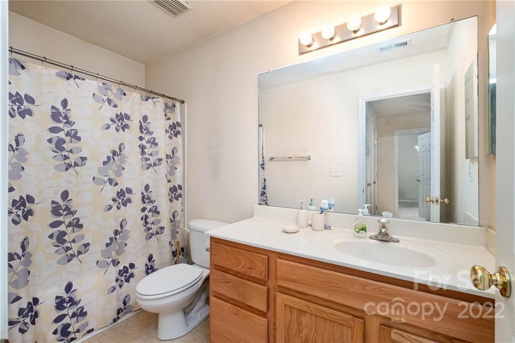 16865 Timber Crossing Road Charlotte, NC 28213 - Photo 29 of 36 a bathroom with a sink toilet and shower