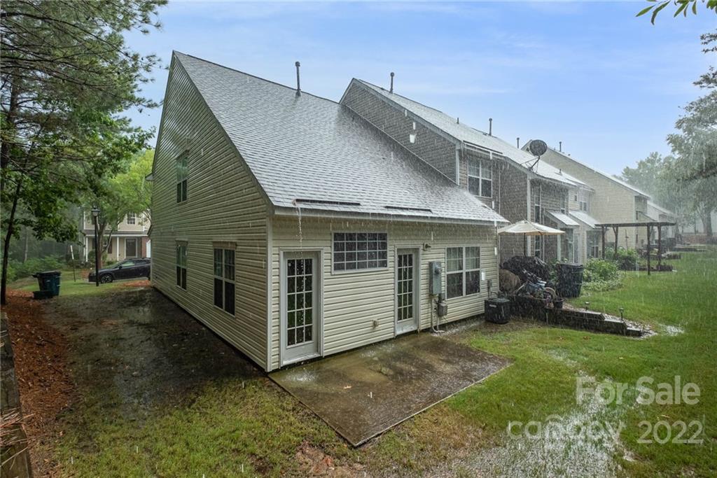 16865 Timber Crossing Road Charlotte, NC 28213 - Photo 33 of 36 a view of a house with a yard