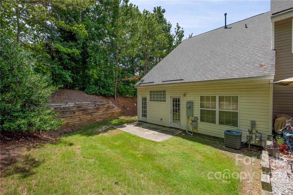 16865 Timber Crossing Road Charlotte, NC 28213 - Photo 34 of 36 a view of a house with backyard and sitting area