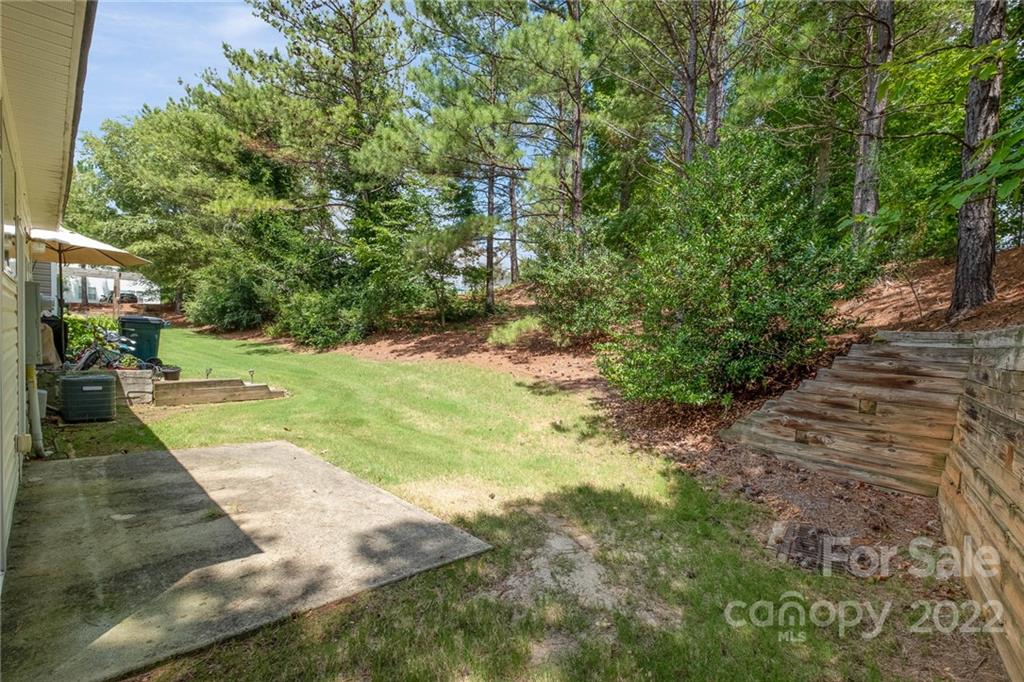 16865 Timber Crossing Road Charlotte, NC 28213 - Photo 36 of 36 a view of yard with swimming pool