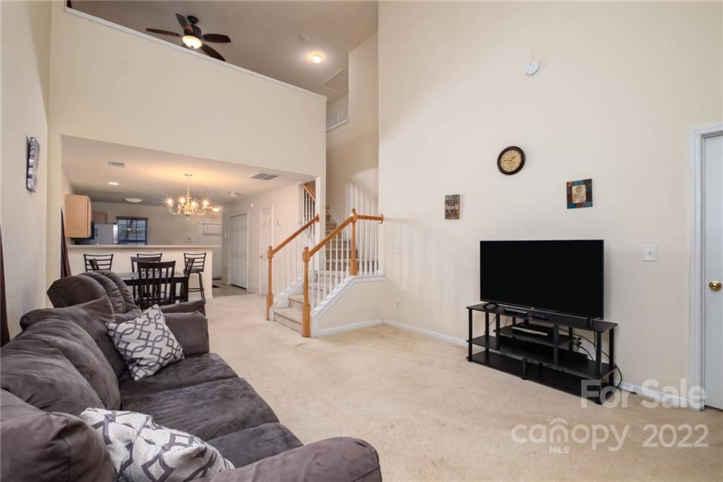 16865 Timber Crossing Road Charlotte, NC 28213 - Photo 7 of 36 a living room with furniture and a flat screen tv