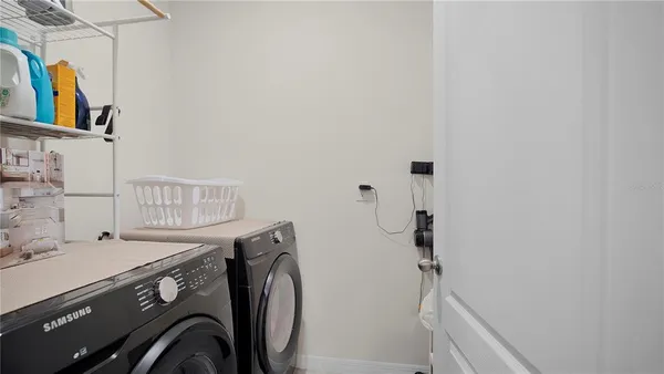 a utility room with dryer and washer