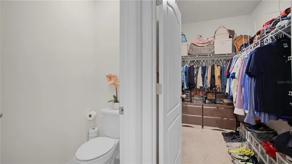 a en suite bathroom with a double vanity sink and large mirror