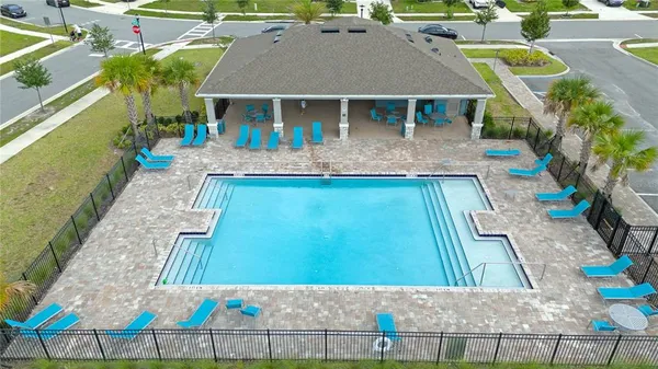 swimming pool view with a outdoor seating
