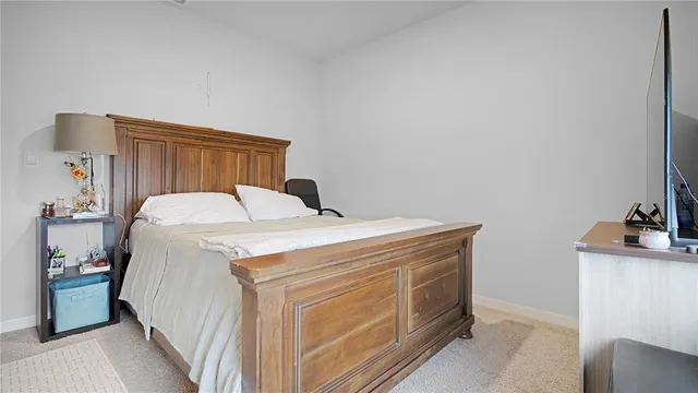 a spacious bedroom with a bed and a desk