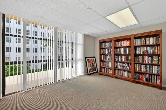 a view of an empty room with a book shelf