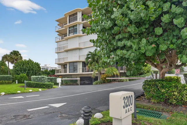 a front view of a building with garden