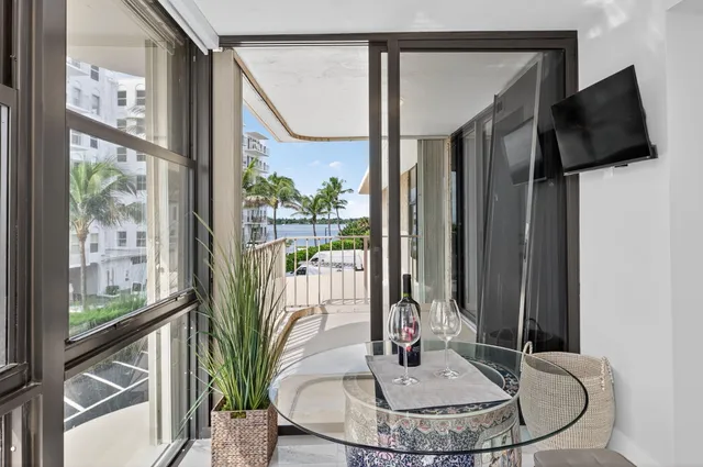 a vase of flowers sitting next to a window