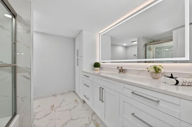 a bathroom with a sink and a mirror