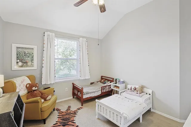 a bedroom with furniture and a window
