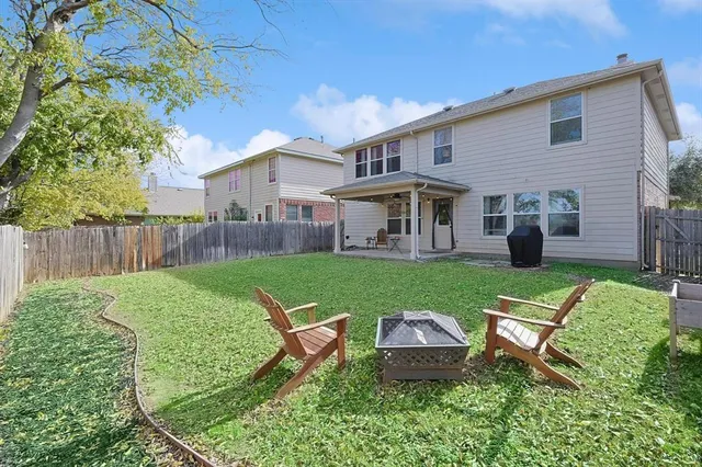 a view of a house with a yard porch and sitting area