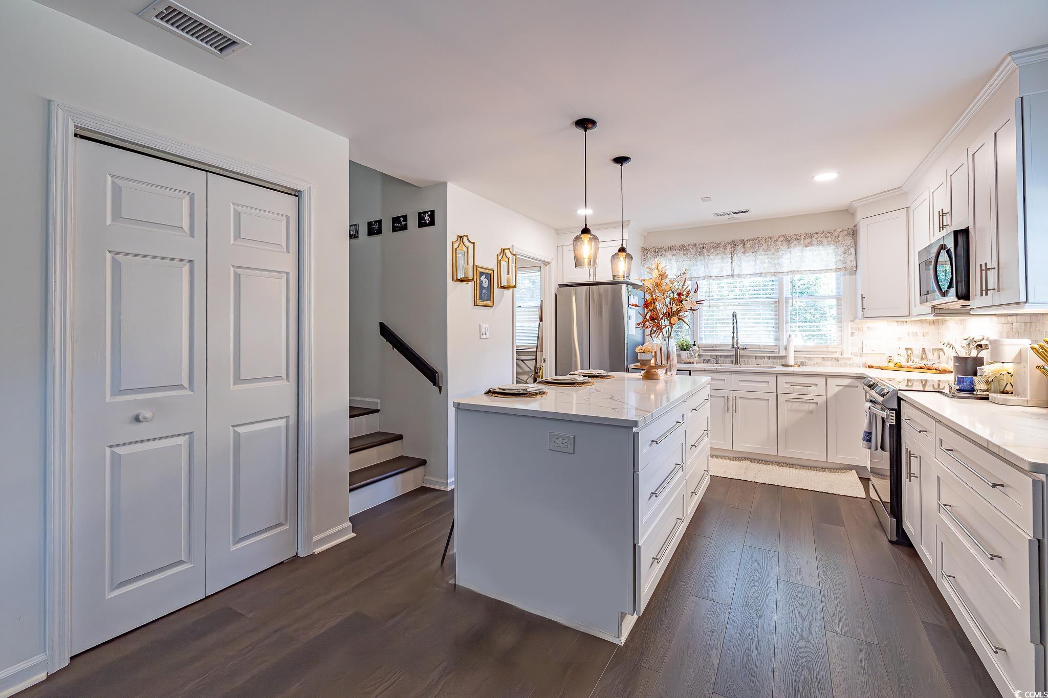 5137 Highway 17 Business, Unit 3A Murrells Inlet, SC 29576 - Photo 17 of 31 Kitchen with white cabinetry, dark wood-style flooring, backsplash, and recessed lighting
