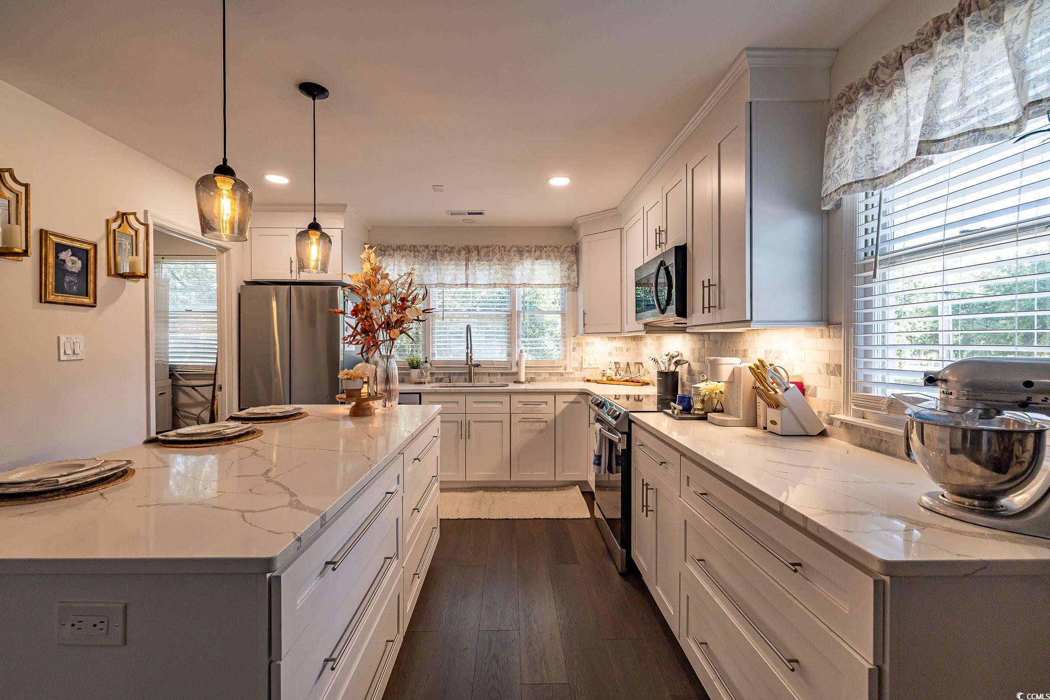 5137 Highway 17 Business, Unit 3A Murrells Inlet, SC 29576 - Photo 19 of 31 Kitchen featuring stainless steel appliances, a center island, backsplash, dark wood-type flooring, and decorative light fixtures