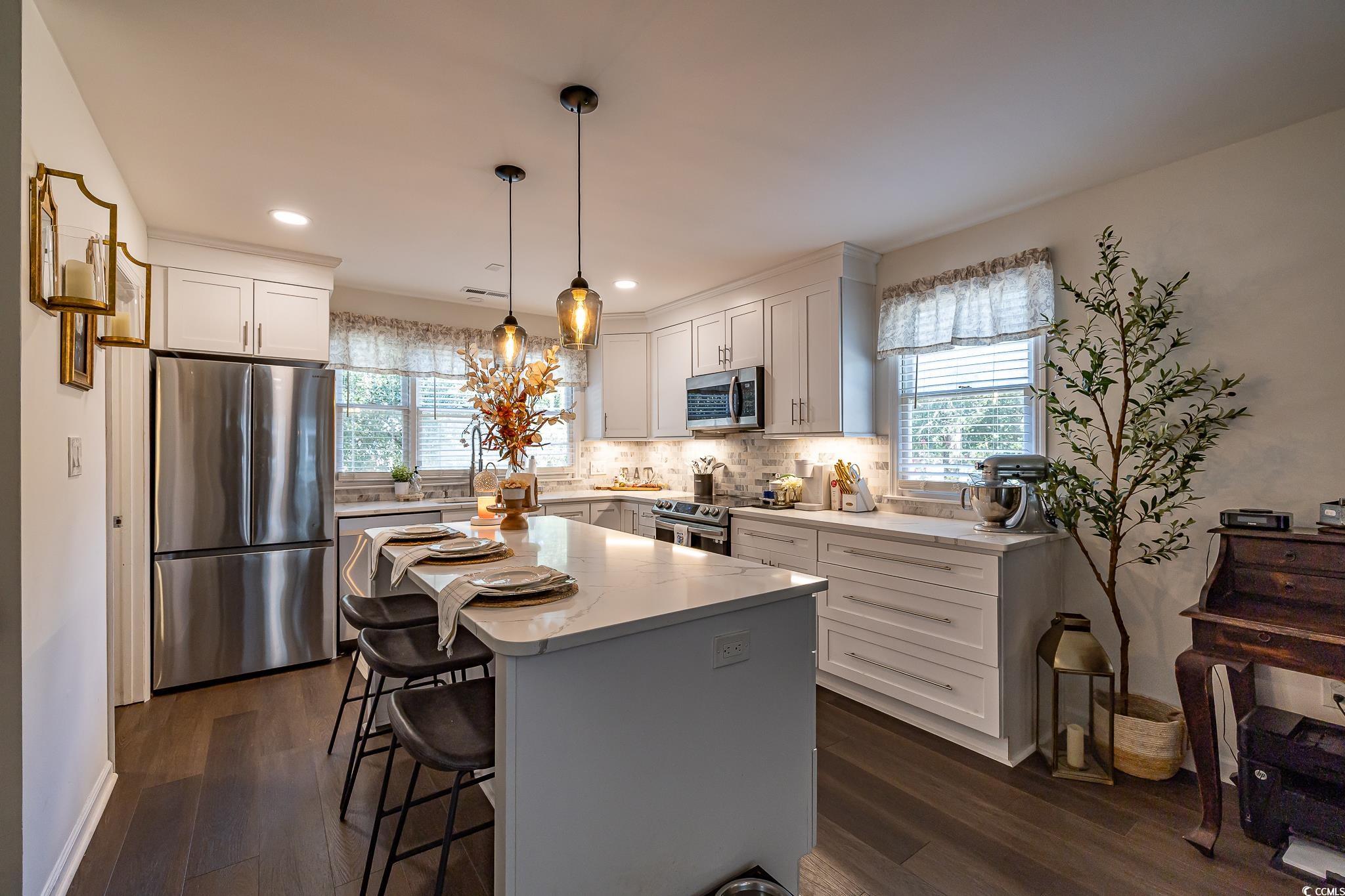 5137 Highway 17 Business, Unit 3A Murrells Inlet, SC 29576 - Photo 20 of 31 Kitchen with appliances with stainless steel finishes, dark wood-type flooring, white cabinetry, and recessed lighting