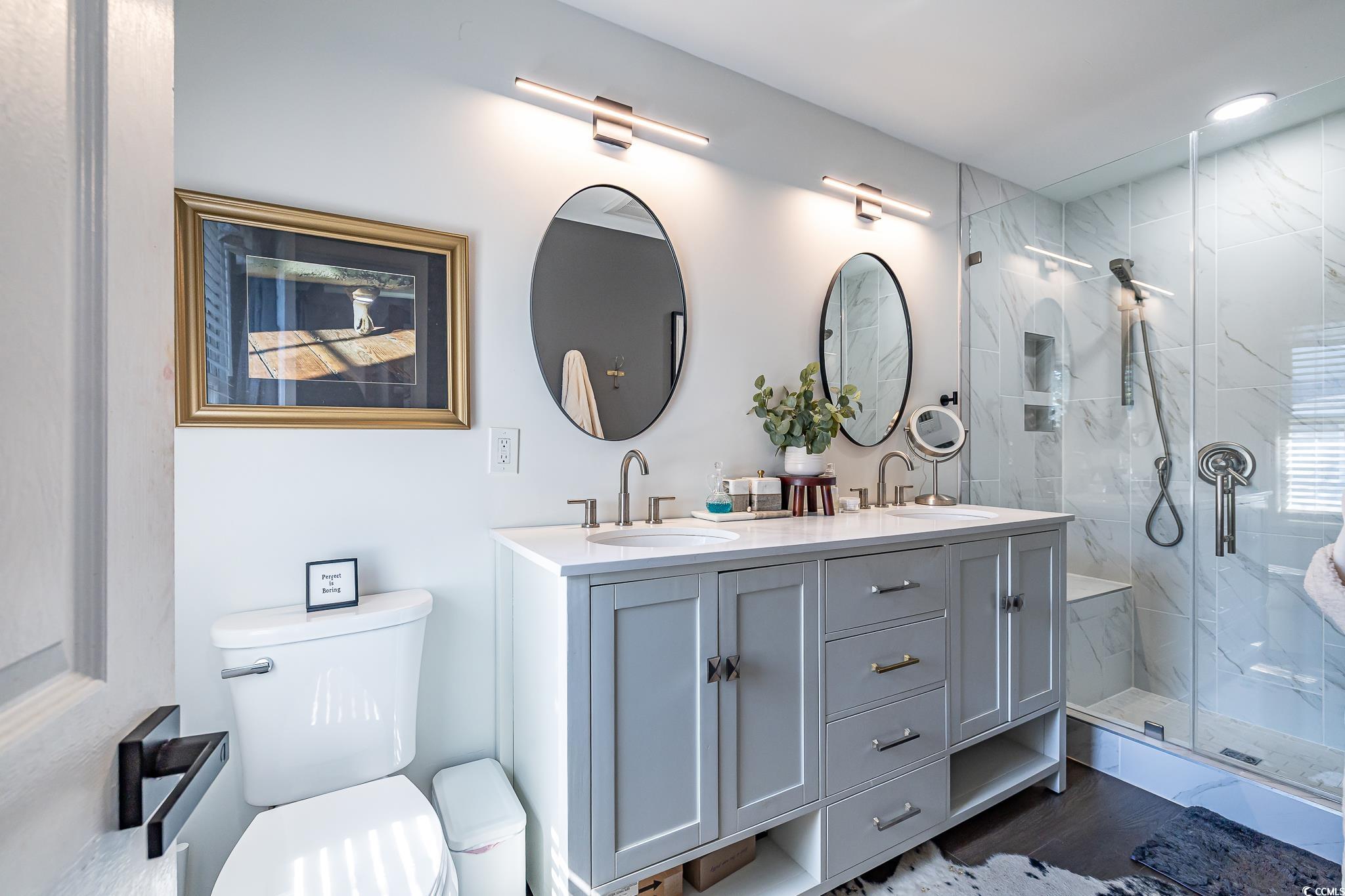 5137 Highway 17 Business, Unit 3A Murrells Inlet, SC 29576 - Photo 24 of 31 Bathroom with a marble finish shower, double vanity, and dark wood-style flooring