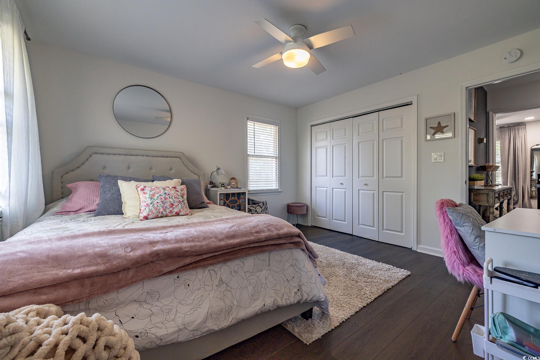 5137 Highway 17 Business, Unit 3A Murrells Inlet, SC 29576 - Photo 25 of 31 Bedroom with dark wood-style flooring, a closet, and ceiling fan
