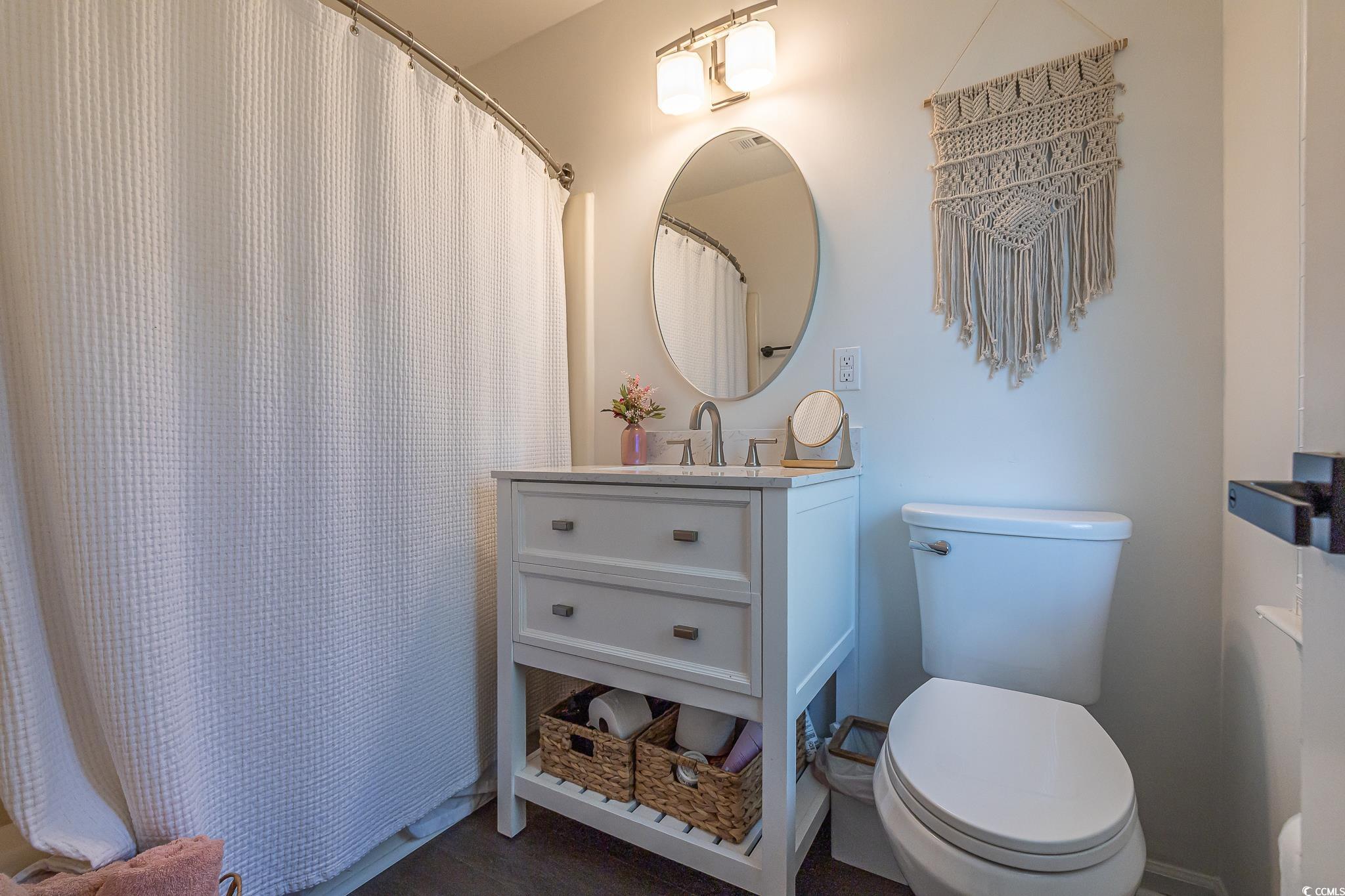 5137 Highway 17 Business, Unit 3A Murrells Inlet, SC 29576 - Photo 26 of 31 Bathroom with vanity and curtained shower