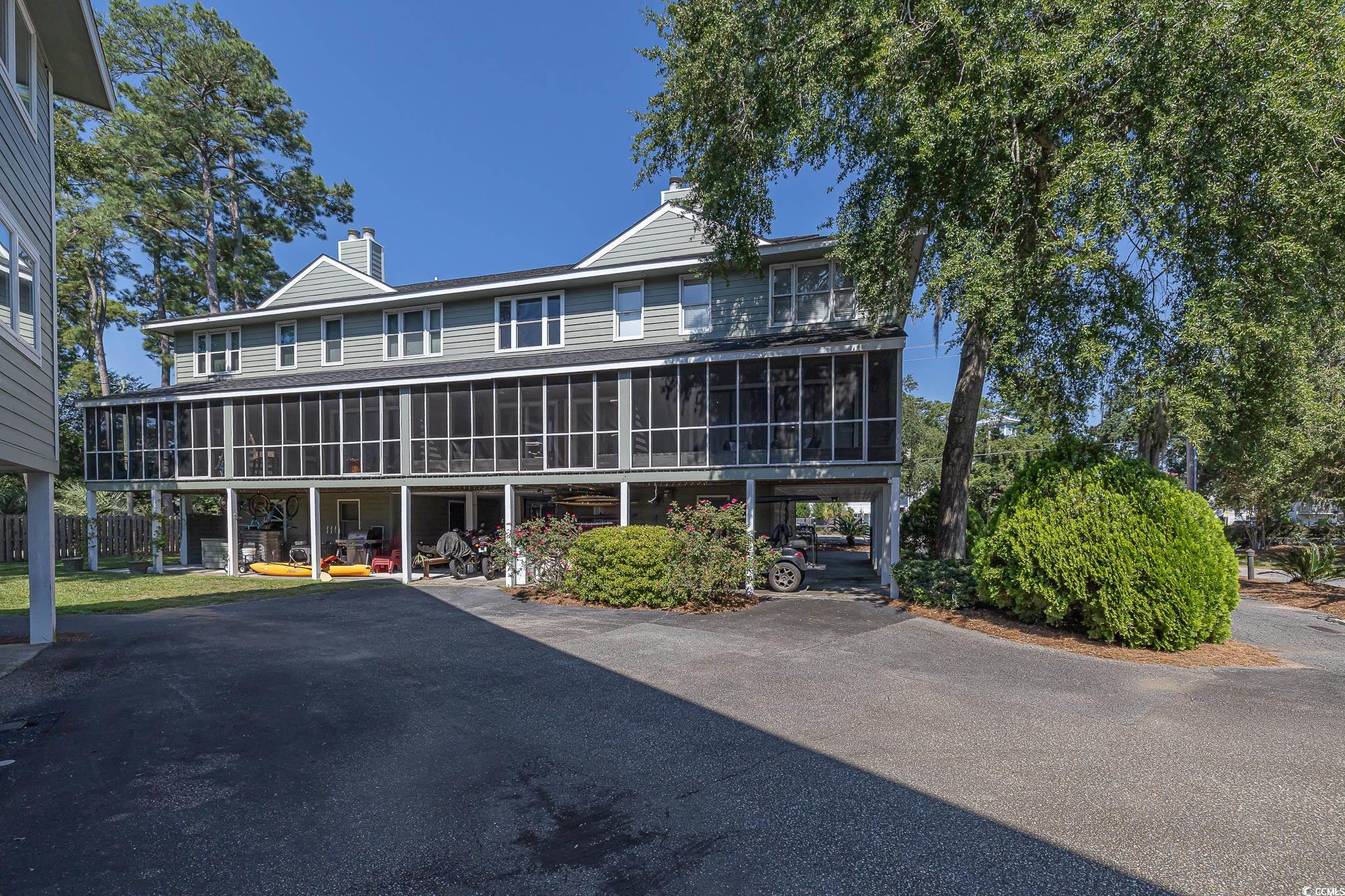 5137 Highway 17 Business, Unit 3A Murrells Inlet, SC 29576 - Photo 3 of 31 View of building exterior featuring a carport