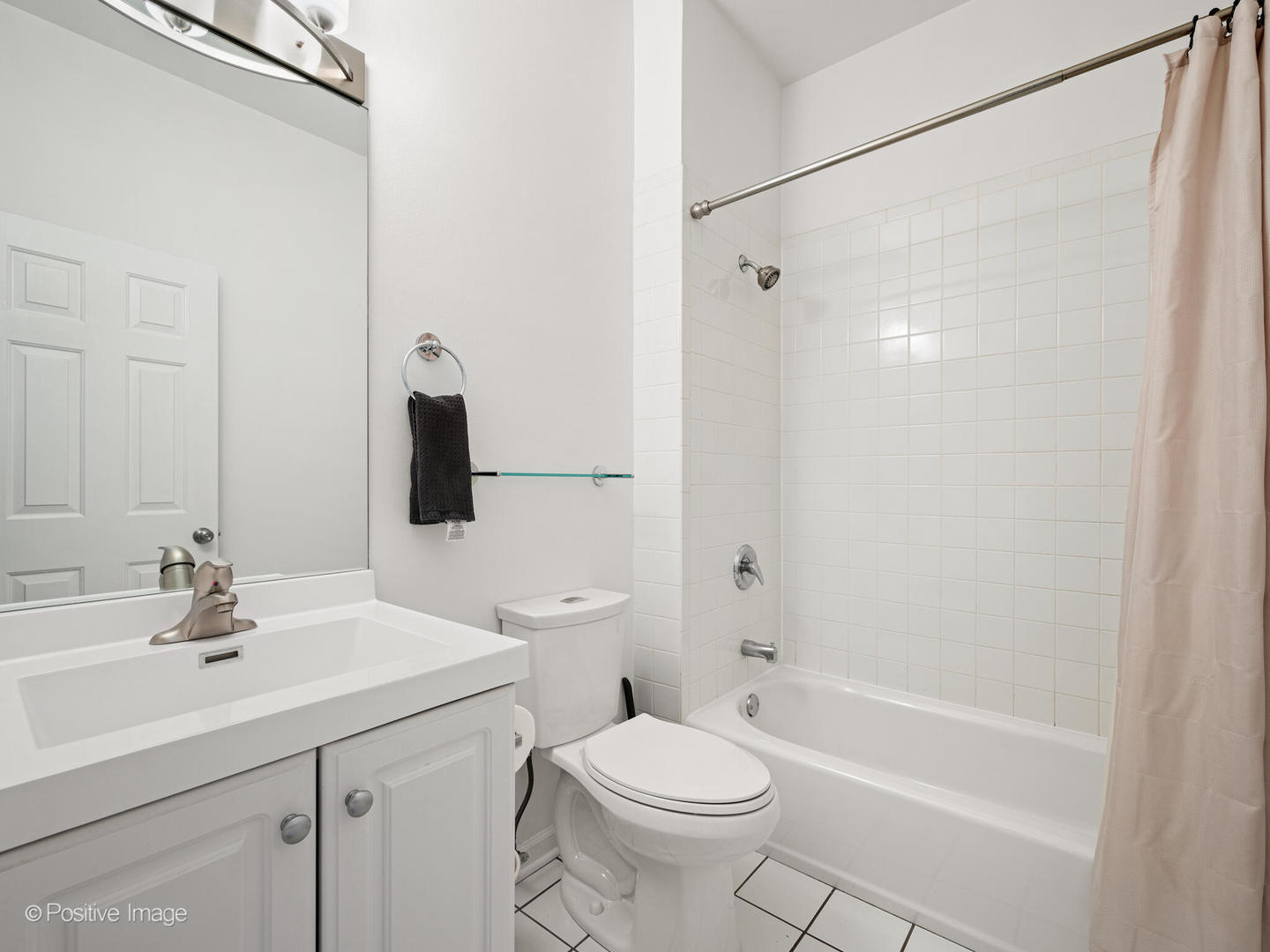 855 West Erie Street, Unit 107 Chicago, IL 60642 - Photo 12 of 21 a bathroom with a sink toilet and shower