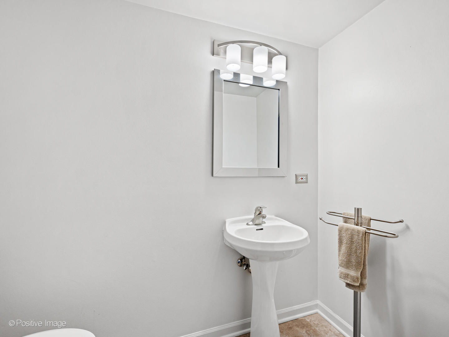 855 West Erie Street, Unit 107 Chicago, IL 60642 - Photo 16 of 21 a bathroom with a sink a mirror and shower