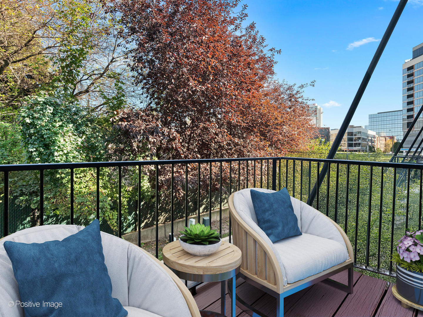 855 West Erie Street, Unit 107 Chicago, IL 60642 - Photo 17 of 21 a balcony with table and chairs