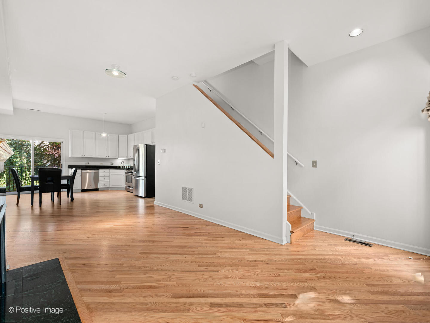 855 West Erie Street, Unit 107 Chicago, IL 60642 - Photo 3 of 21 a view of empty room with wooden floor