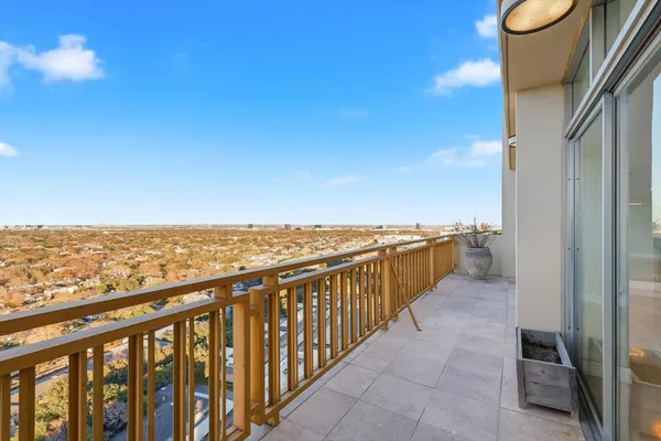 a view of a balcony with an ocean view