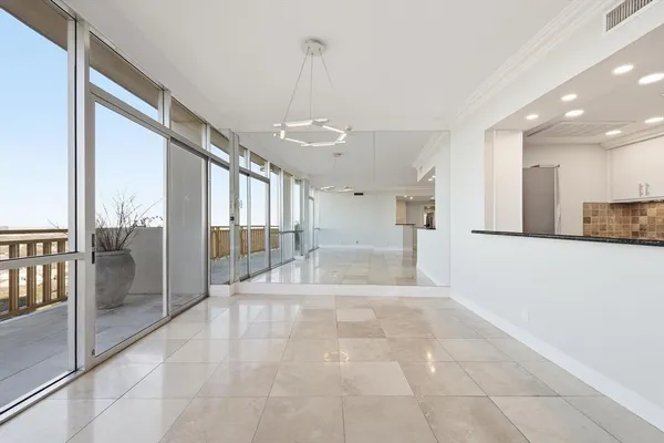 a view of a hallway with a chandelier