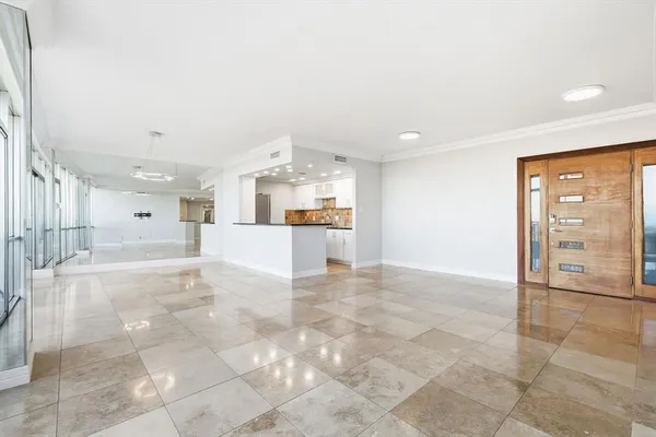 a view of a electric appliances in kitchen and a livingroom