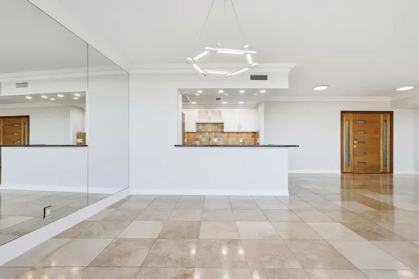 a kitchen with stainless steel appliances granite countertop a sink and a refrigerator