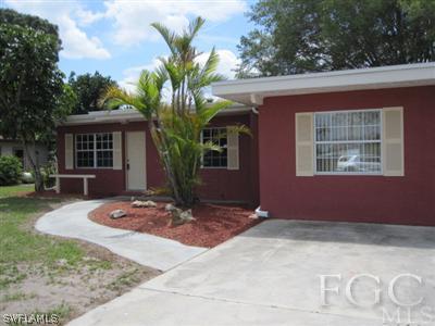 2120 Earl Road Fort Myers, FL 33901 - Photo 1 of 10 a front view of a house with garden
