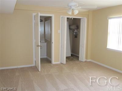 2120 Earl Road Fort Myers, FL 33901 - Photo 2 of 10 an empty room with windows and closet