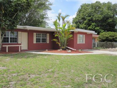 2120 Earl Road Fort Myers, FL 33901 - Photo 3 of 10 a front view of a house with a yard