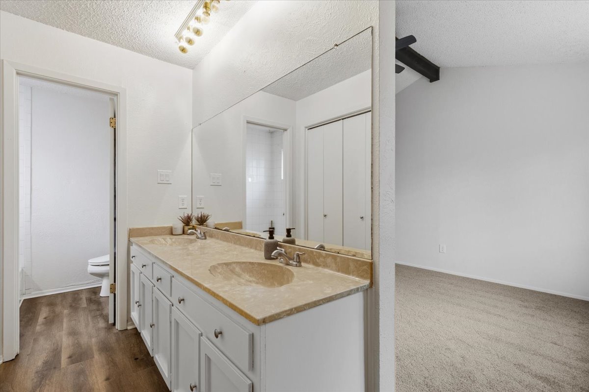 511 Suzzane Road Pflugerville, TX 78660 - Photo 15 of 35 a bathroom with a sink a vanity and a mirror