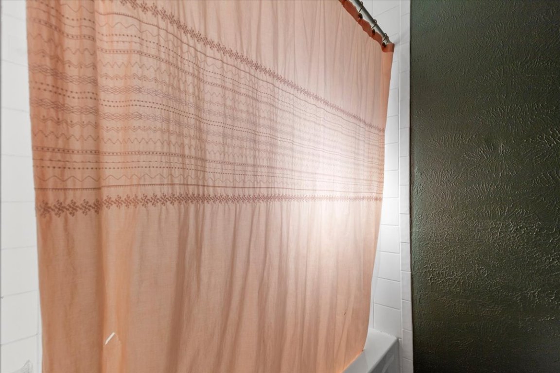 511 Suzzane Road Pflugerville, TX 78660 - Photo 18 of 34 Bathroom view of shower / tub combo with curtain