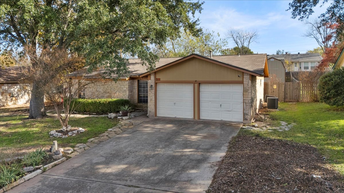 511 Suzzane Road Pflugerville, TX 78660 - Photo 2 of 34 View of front of house featuring driveway and a garage