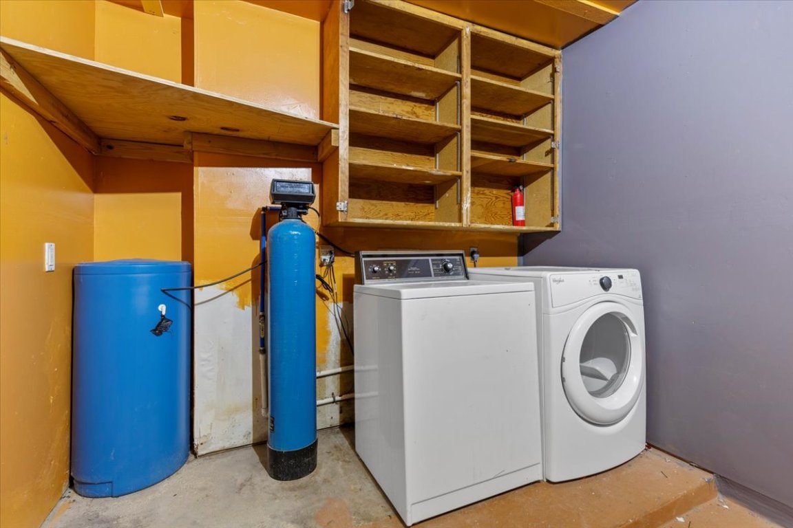 511 Suzzane Road Pflugerville, TX 78660 - Photo 24 of 34 Laundry are in garage featuring concrete floors and separate washer and dryer