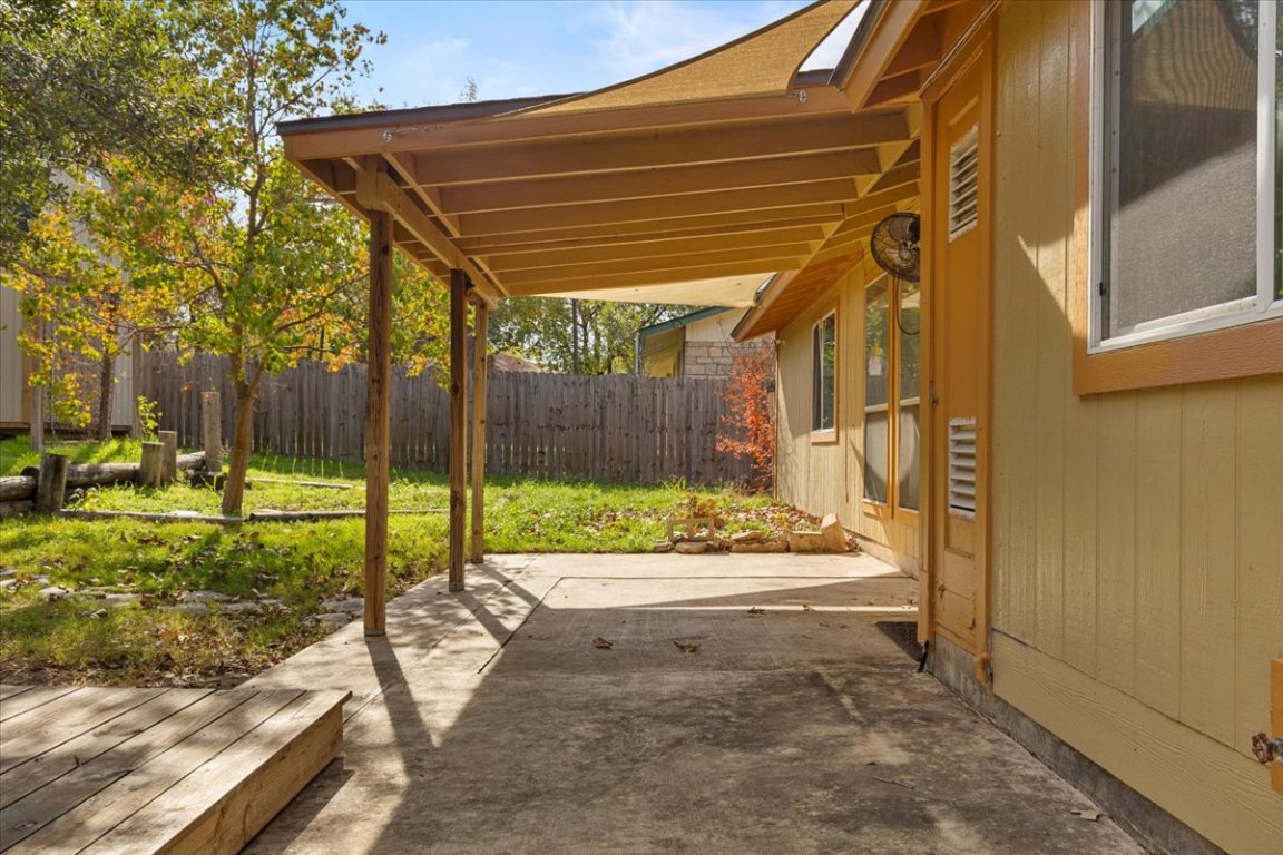 511 Suzzane Road Pflugerville, TX 78660 - Photo 25 of 34 Fenced backyard with a covered patio area
