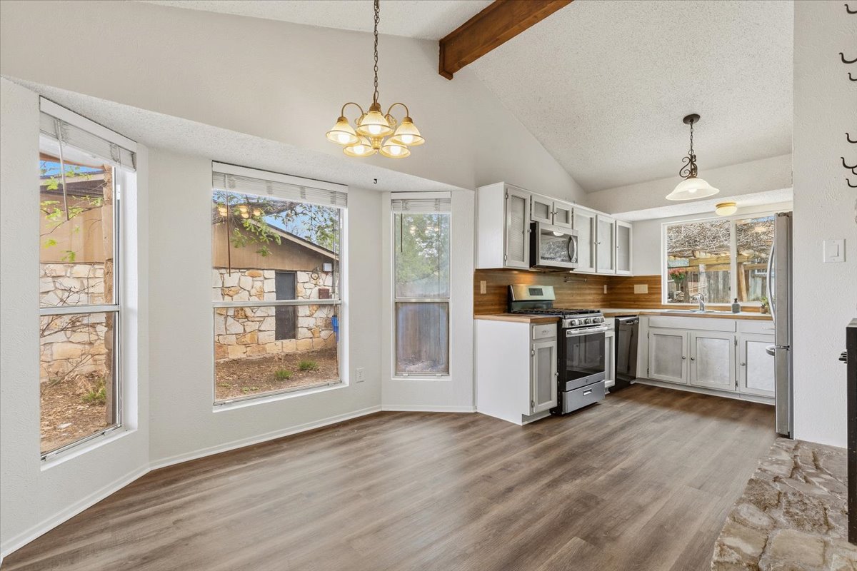 511 Suzzane Road Pflugerville, TX 78660 - Photo 8 of 35 a view of kitchen with window and refrigerator