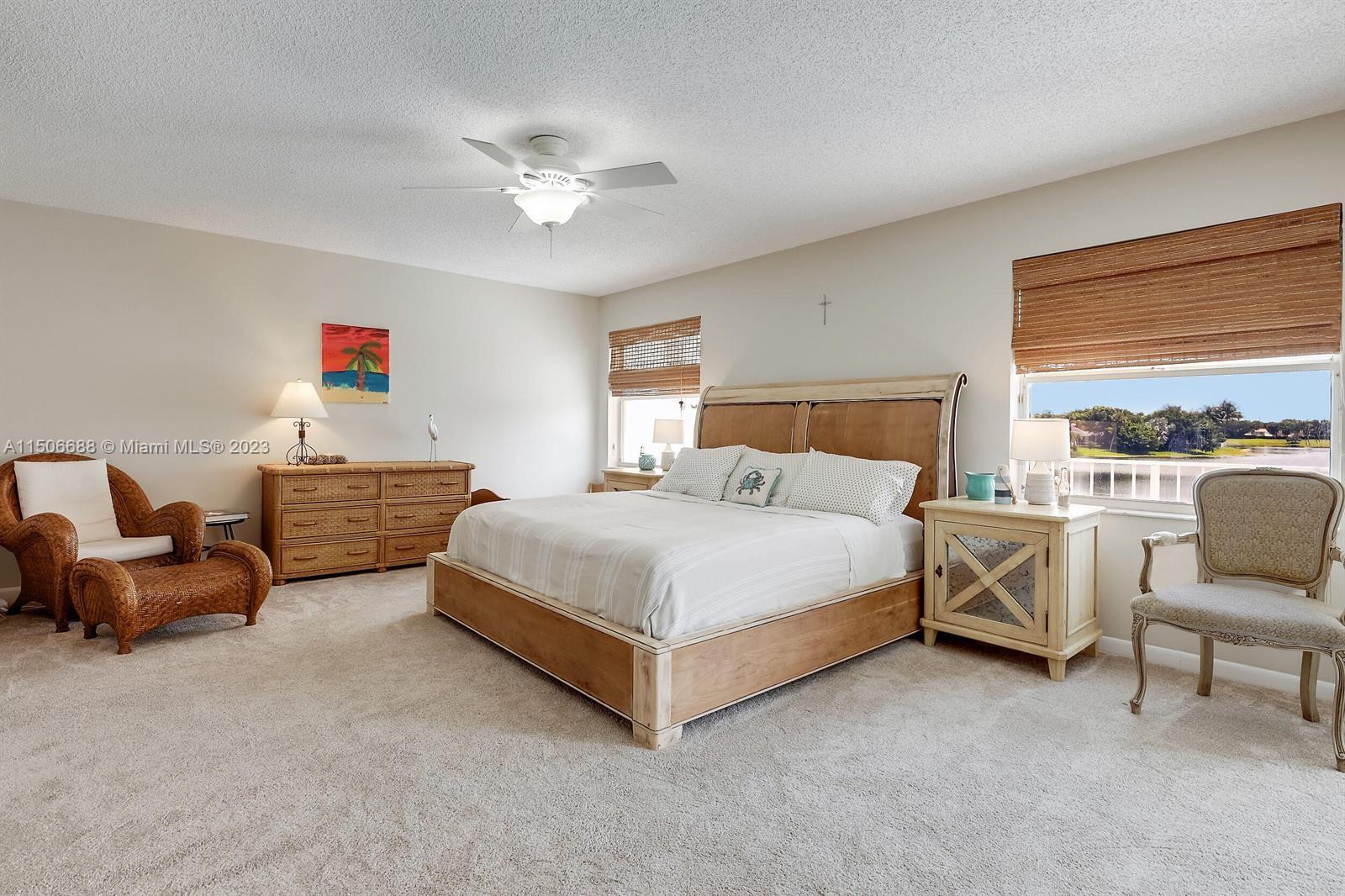 7289 Shell Ridge Terrace Lake Worth, FL 33467 - Photo 28 of 55 a bedroom with a bed and a couch