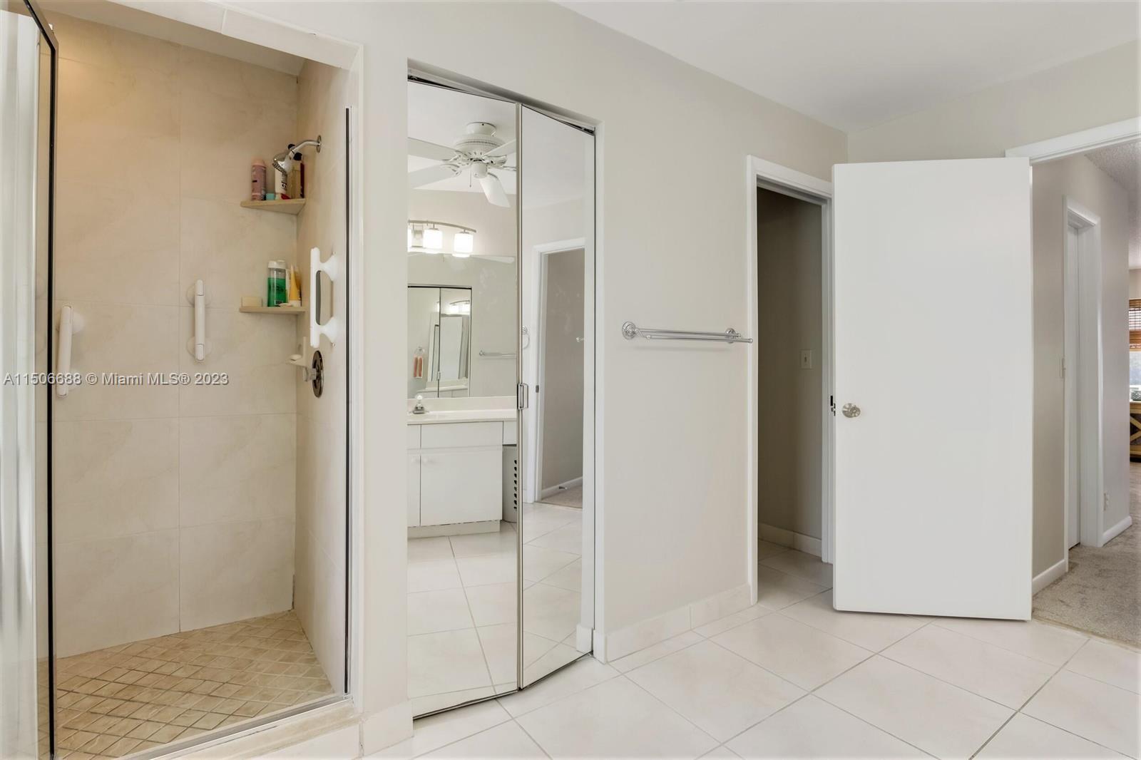 7289 Shell Ridge Terrace Lake Worth, FL 33467 - Photo 31 of 55 a bathroom with a shower and a sink
