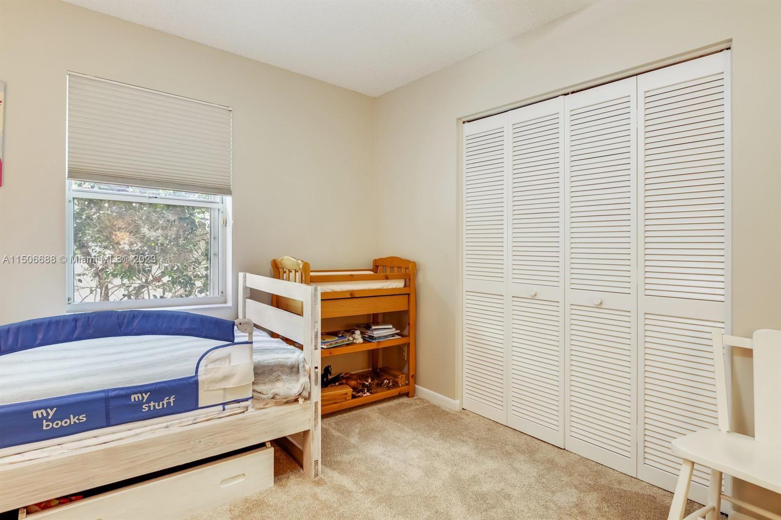 7289 Shell Ridge Terrace Lake Worth, FL 33467 - Photo 34 of 55 a bedroom with a bed and a window