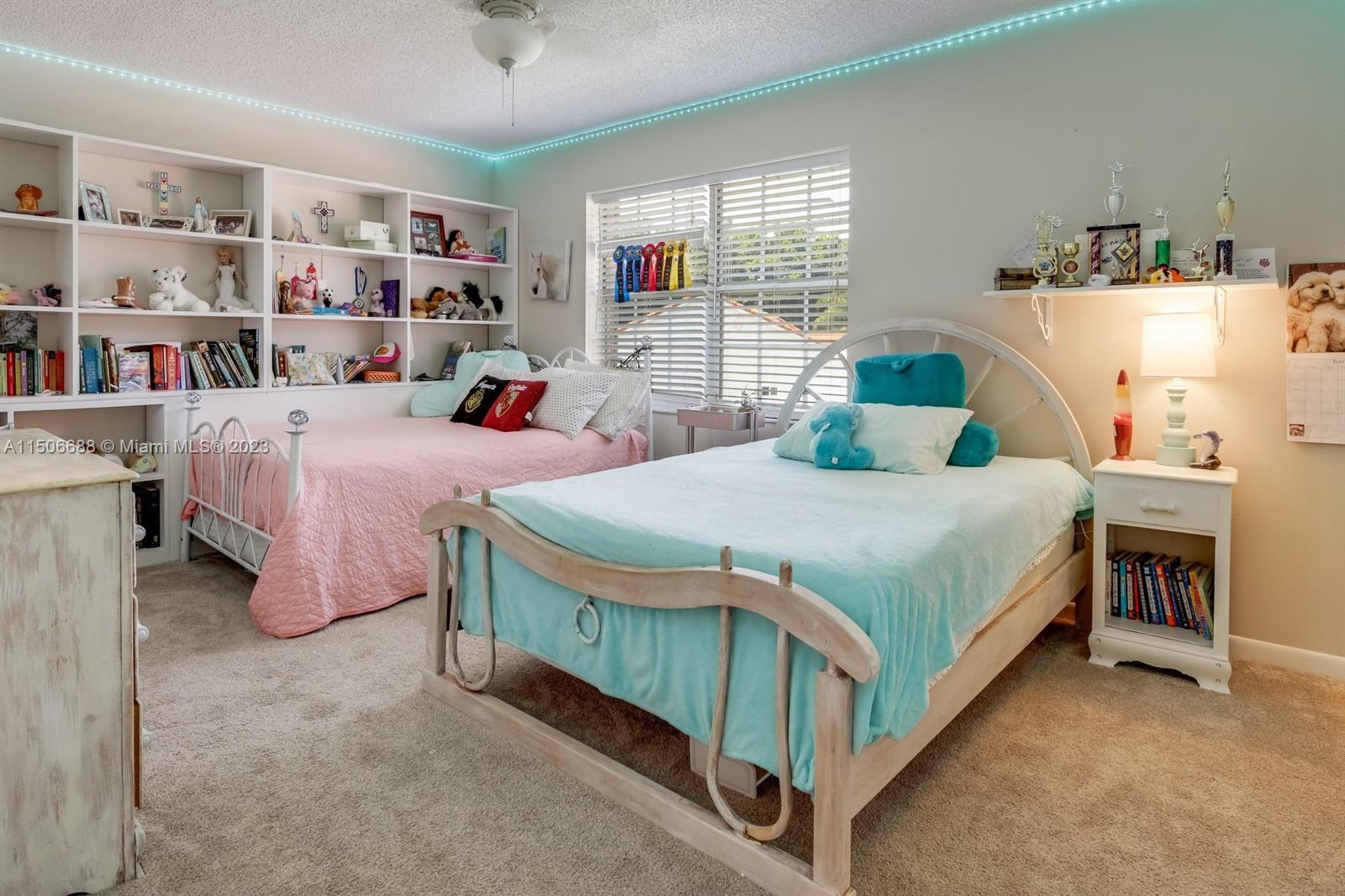 7289 Shell Ridge Terrace Lake Worth, FL 33467 - Photo 36 of 55 a bedroom with two beds and window