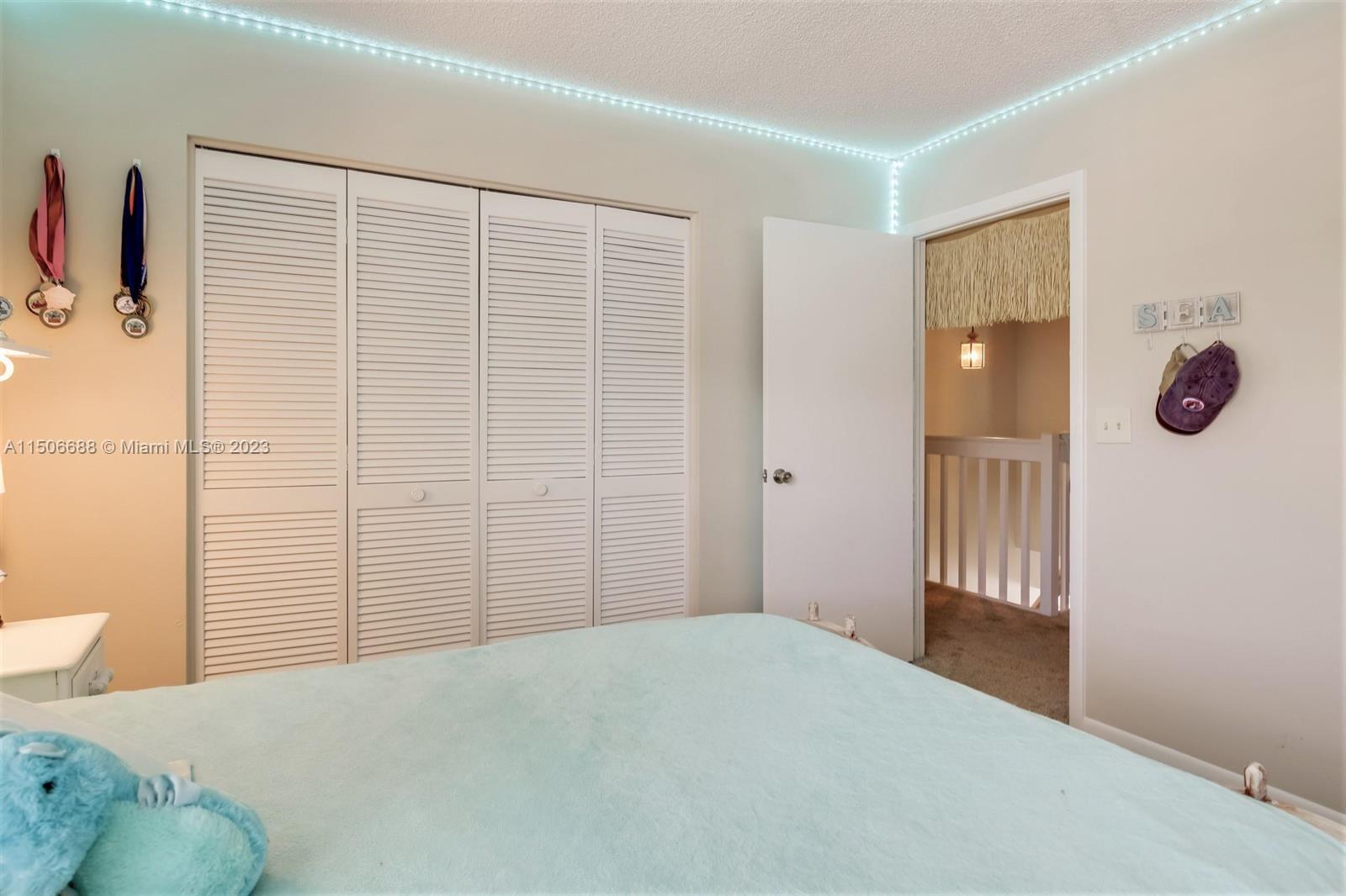 7289 Shell Ridge Terrace Lake Worth, FL 33467 - Photo 38 of 55 a bedroom with a bed and a window