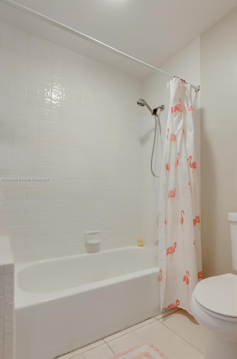 7289 Shell Ridge Terrace Lake Worth, FL 33467 - Photo 39 of 55 a bathroom with a toilet and a bathtub