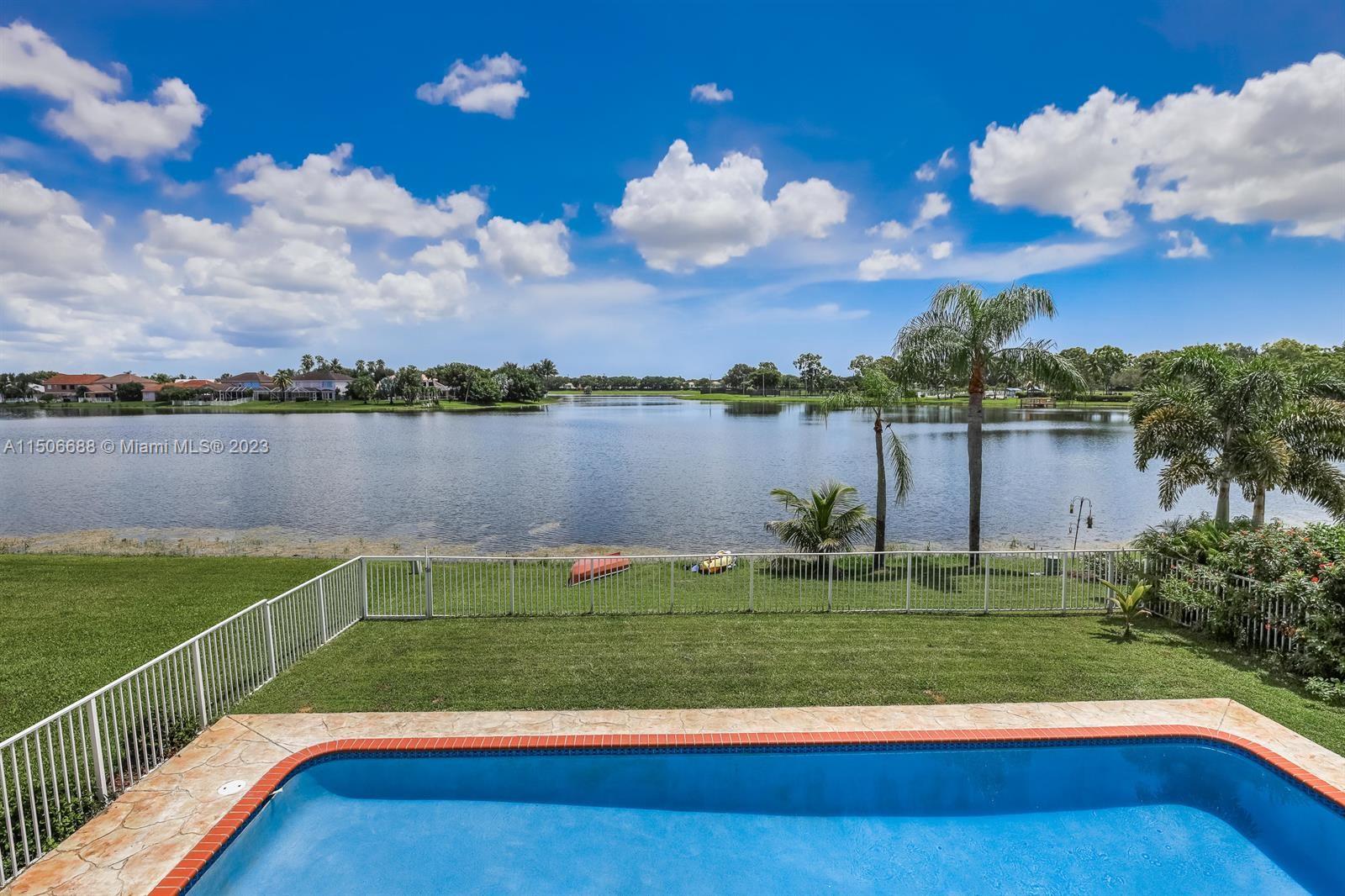 7289 Shell Ridge Terrace Lake Worth, FL 33467 - Photo 42 of 55 a view of a garden with lake