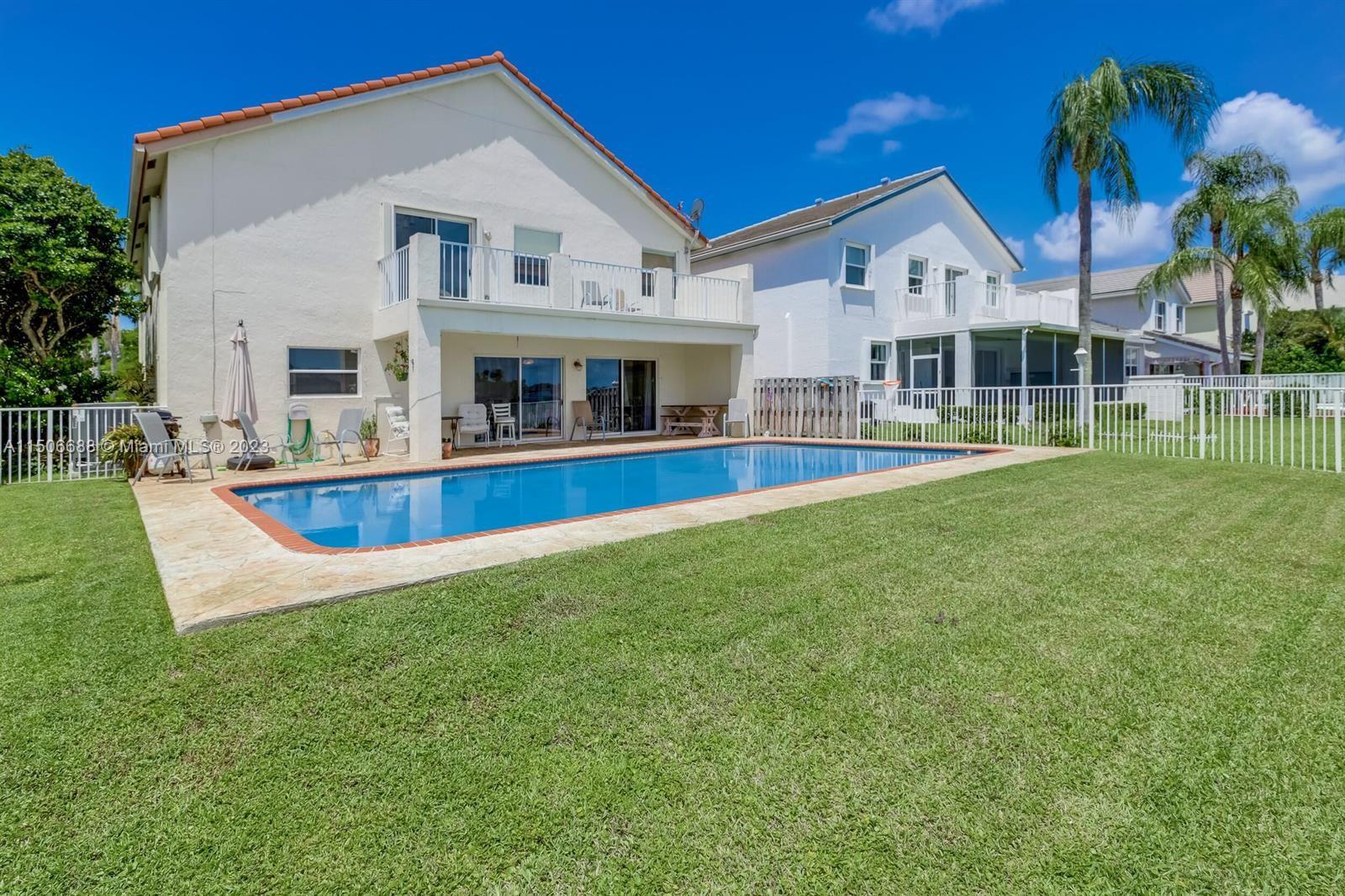 7289 Shell Ridge Terrace Lake Worth, FL 33467 - Photo 45 of 55 a view of a house with a swimming pool
