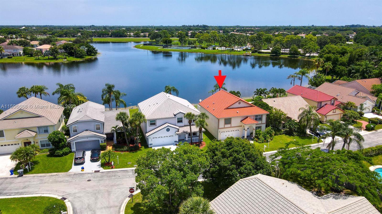 7289 Shell Ridge Terrace Lake Worth, FL 33467 - Photo 5 of 55 a view of lake and houses with outdoor space