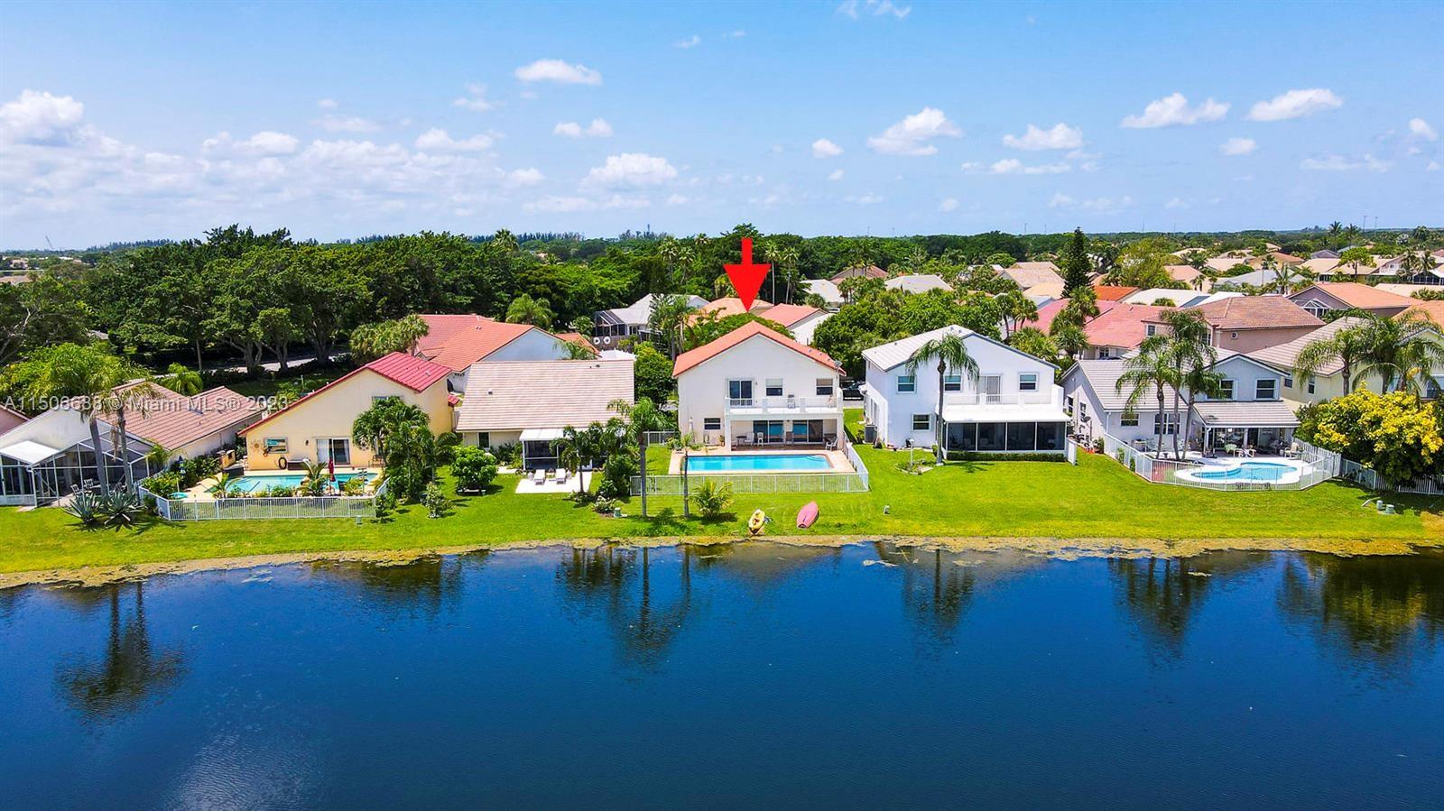 7289 Shell Ridge Terrace Lake Worth, FL 33467 - Photo 6 of 55 a view of an swimming pool and tennis court