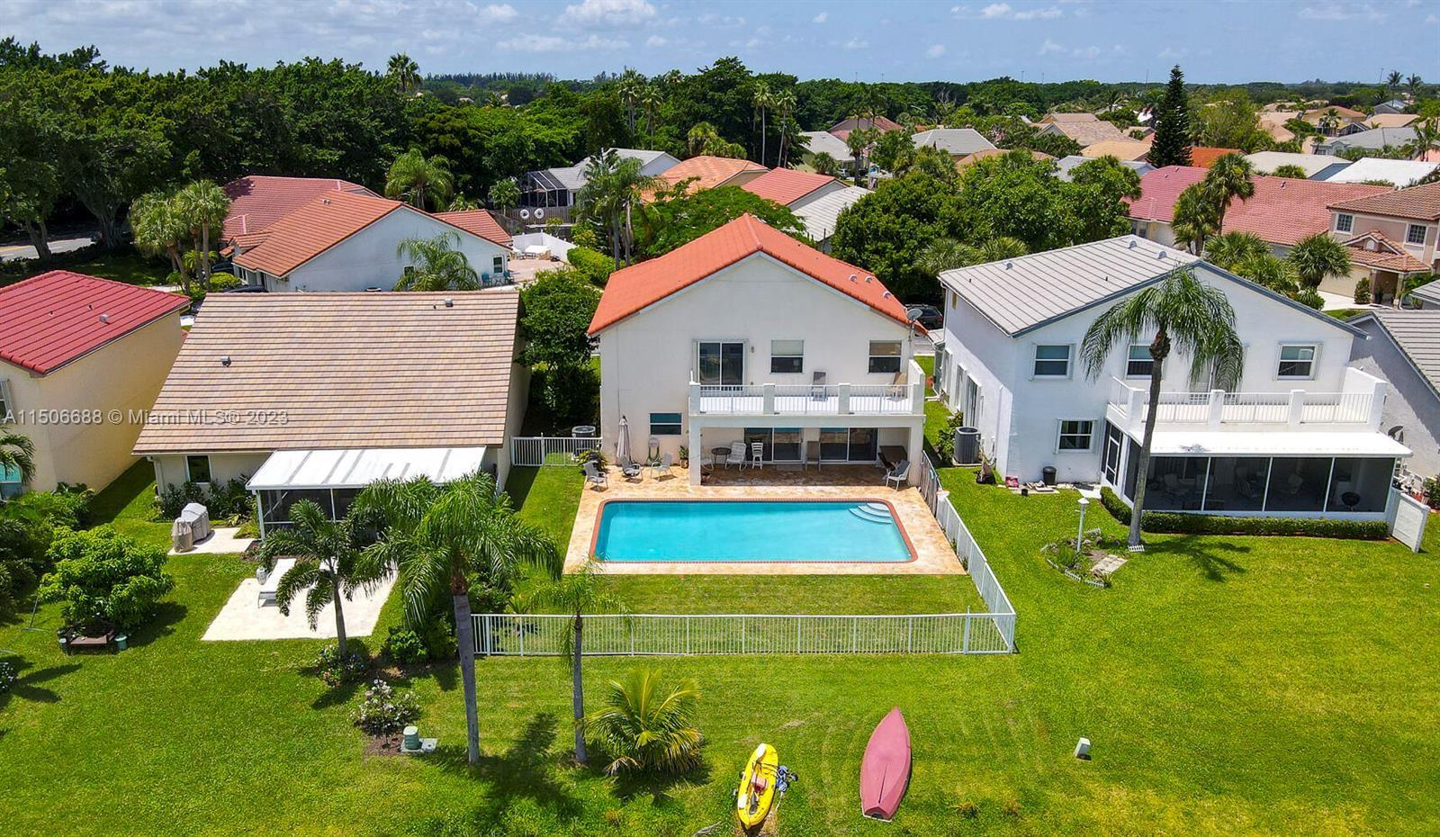 7289 Shell Ridge Terrace Lake Worth, FL 33467 - Photo 7 of 55 an aerial view of a house with swimming pool garden and patio